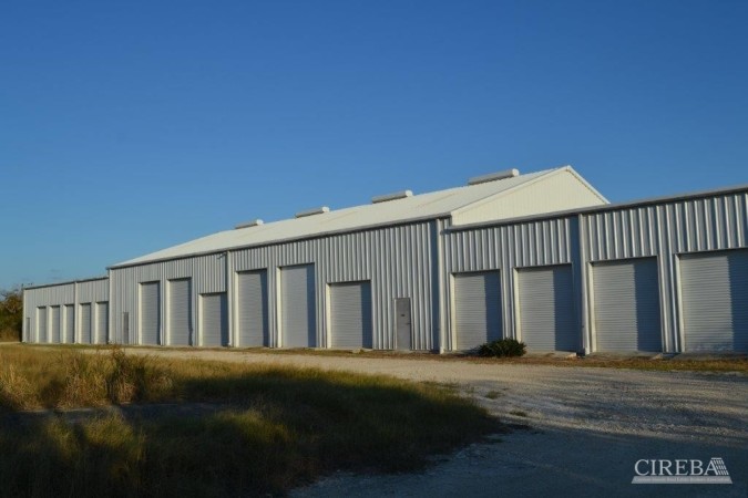 LITTLE CAYMAN WAREHOUSE (20 UNITS) AND LAND SUB-DIVISION  13 LOTS