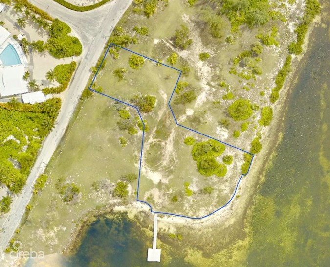 CAYMAN KAI- WATER CAY RD LOT W/DOCK AND 250FT OF BEACHFRONT ON LITTLE SOUND