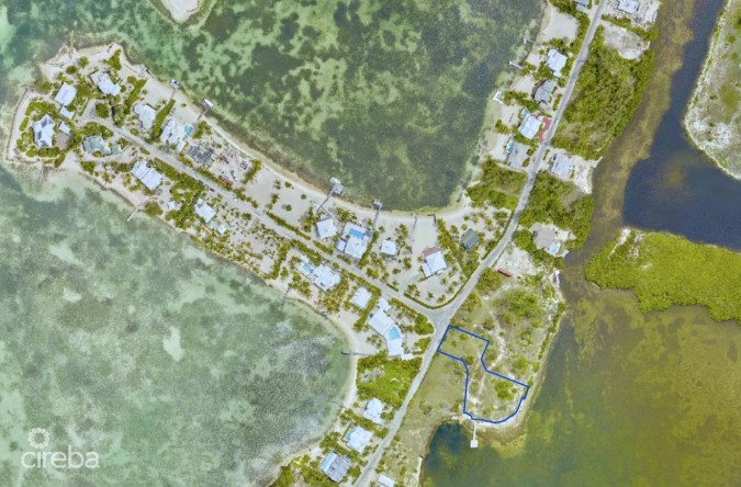CAYMAN KAI- WATER CAY RD LOT W/DOCK AND 250FT OF BEACHFRONT ON LITTLE SOUND