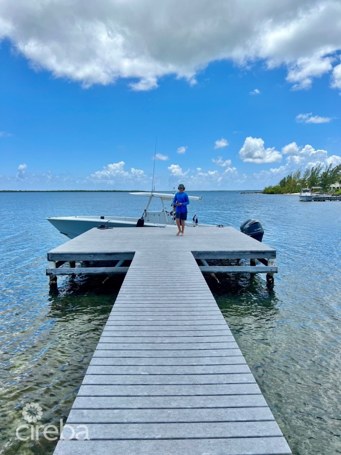 CAYMAN KAI- WATER CAY RD LOT W/DOCK AND 250FT OF BEACHFRONT ON LITTLE SOUND