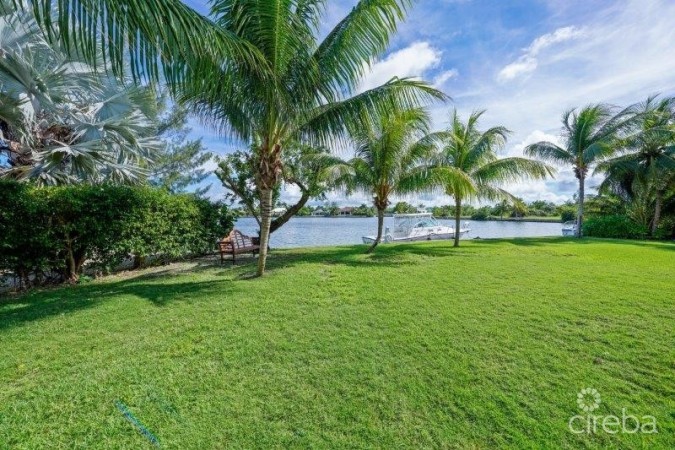 UNIQUE PATRICK’S ISLAND CANAL FRONT HOME WITH GUEST HOUSE AND 3 CAR GARAGE