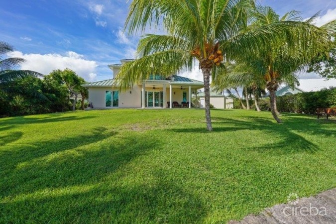 UNIQUE PATRICK’S ISLAND CANAL FRONT HOME WITH GUEST HOUSE AND 3 CAR GARAGE