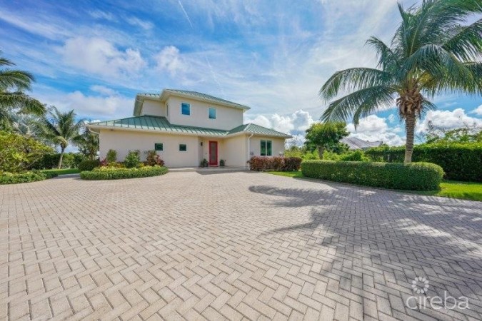 UNIQUE PATRICK’S ISLAND CANAL FRONT HOME WITH GUEST HOUSE AND 3 CAR GARAGE