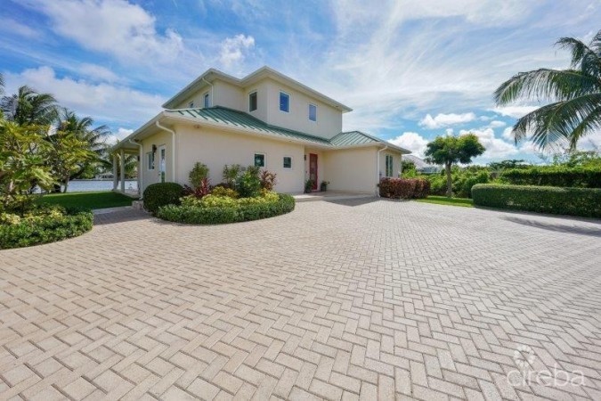 UNIQUE PATRICK’S ISLAND CANAL FRONT HOME WITH GUEST HOUSE AND 3 CAR GARAGE