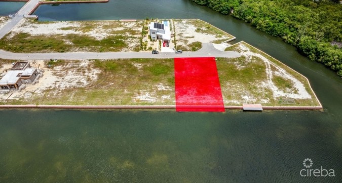 MUSTIQUE COVE CANAL FRONT LOT