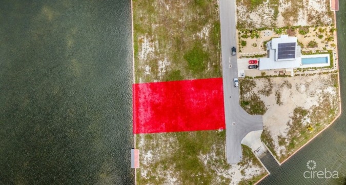 MUSTIQUE COVE CANAL FRONT LOT