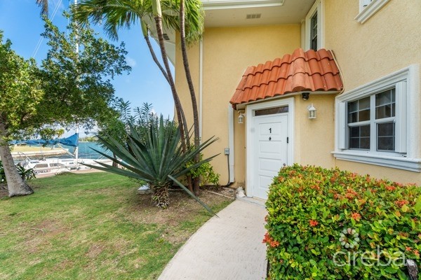 7 MILE BEACH CORRIDOR  3-BED  WATERFRONT TOWNHOUSE ON MAGELLAN QUAY IN GOVERNOR'S HARBOUR