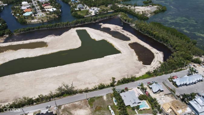 AUBURN BAY, LARGE CANAL FRONT LOT, READY TO BUILD