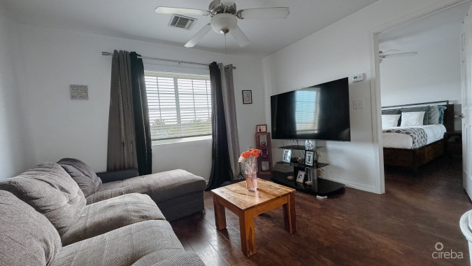 LAKESIDE CONDO NEAR CAMANA BAY