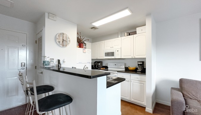 LAKESIDE CONDO NEAR CAMANA BAY