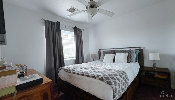 LAKESIDE CONDO NEAR CAMANA BAY