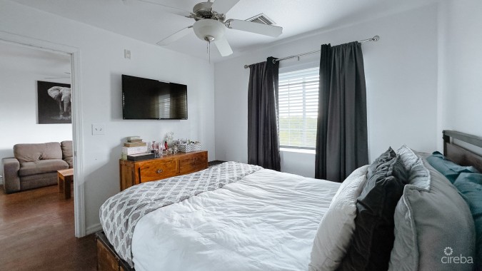 LAKESIDE CONDO NEAR CAMANA BAY