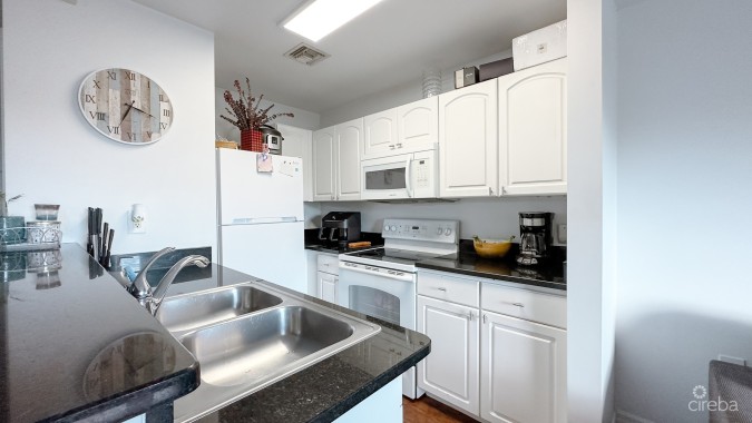 LAKESIDE CONDO NEAR CAMANA BAY