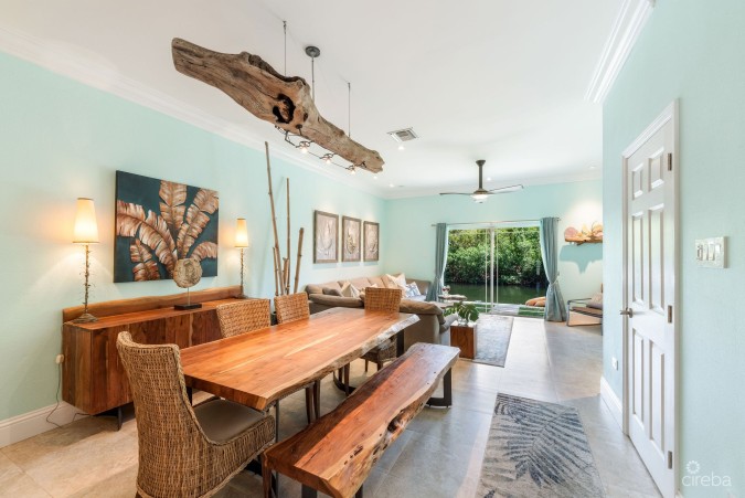 UPGRADED COASTAL ESCAPE CANAL FRONT TOWNHOUSE
