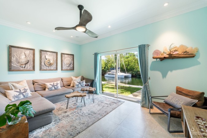 UPGRADED COASTAL ESCAPE CANAL FRONT TOWNHOUSE