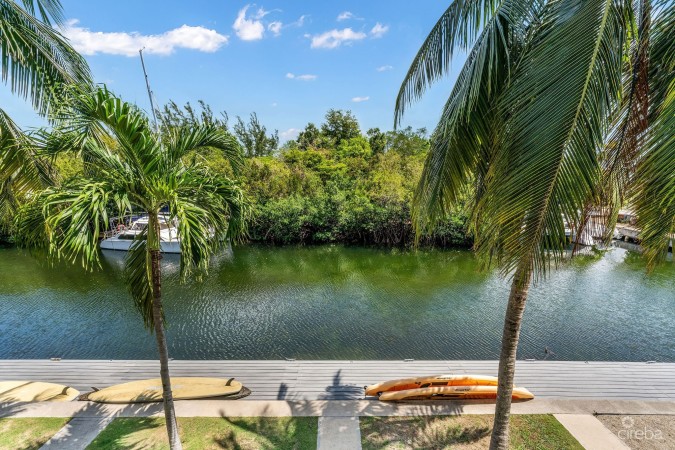 UPGRADED COASTAL ESCAPE CANAL FRONT TOWNHOUSE