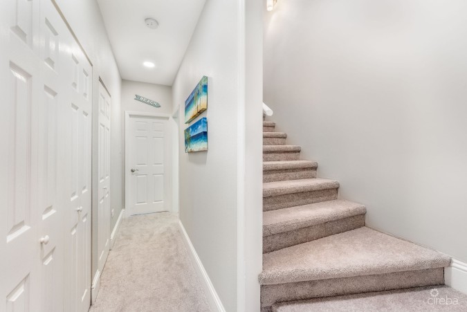 UPGRADED COASTAL ESCAPE CANAL FRONT TOWNHOUSE