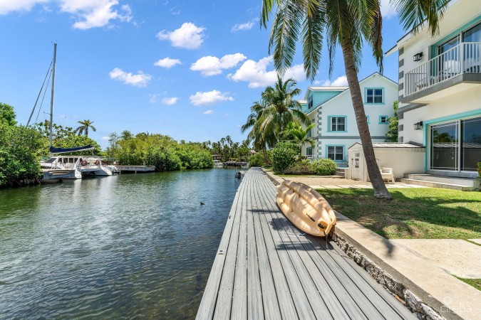 UPGRADED COASTAL ESCAPE CANAL FRONT TOWNHOUSE
