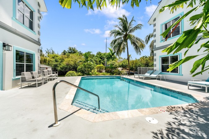 UPGRADED COASTAL ESCAPE CANAL FRONT TOWNHOUSE