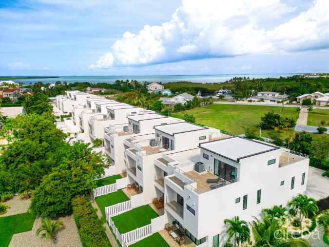 MODERN 2-BEDROOM + DEN TOWNHOME AT SALT AIR – GATED LIVING IN WEST BAY
