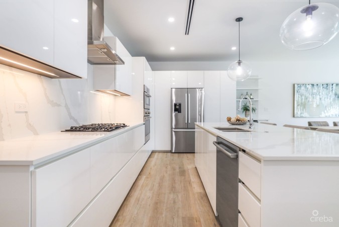 MODERN 2-BEDROOM + DEN TOWNHOME AT SALT AIR – GATED LIVING IN WEST BAY