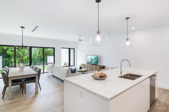 MODERN 2-BEDROOM + DEN TOWNHOME IN SALT AIR | GATED LIVING IN WEST BAY