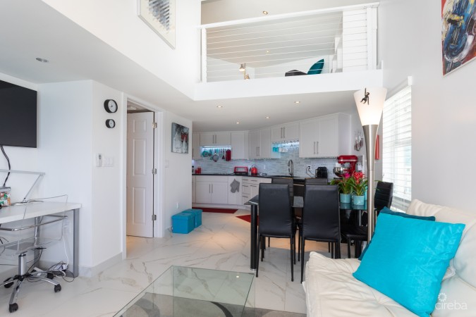 CAYMAN REEF RESORT BEACHFRONT WITH FUTURE REDEVELOPMENT