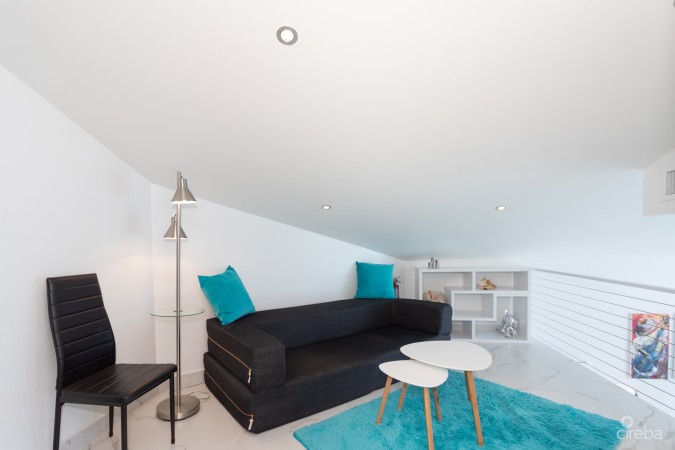 CAYMAN REEF RESORT BEACHFRONT WITH FUTURE REDEVELOPMENT