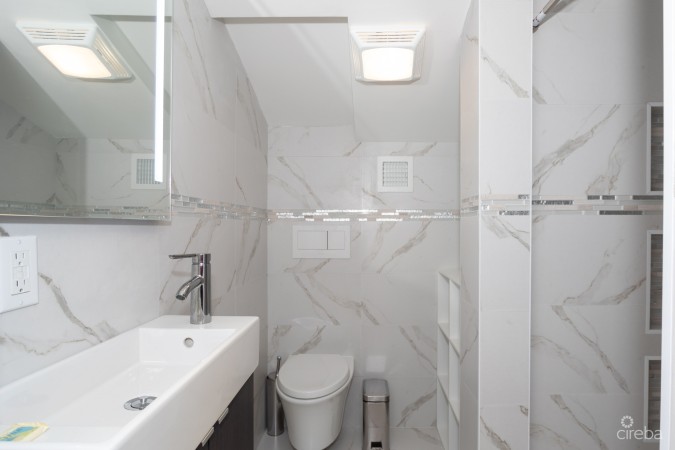 CAYMAN REEF RESORT BEACHFRONT WITH FUTURE REDEVELOPMENT