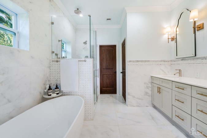 FULLY RENOVATED 4-BED CANAL FRONT HOME WITH DEN & DOCK | THE SHORES