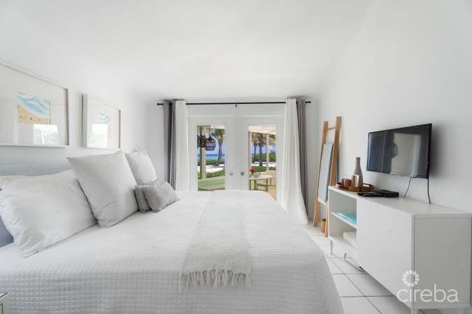 CAYMAN KAI SEA LODGE #13 BEACHFRONT CONDO WITH IMPRESSIVE RENTAL HISTORY