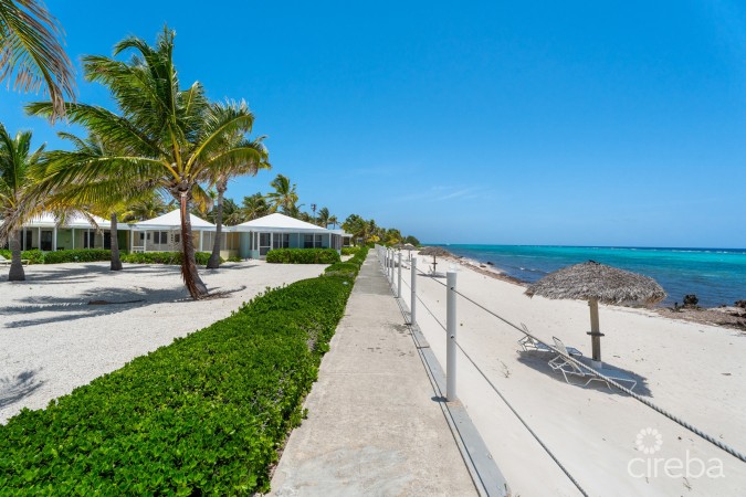 CAYMAN KAI SEA LODGE #13 BEACHFRONT CONDO WITH IMPRESSIVE RENTAL HISTORY