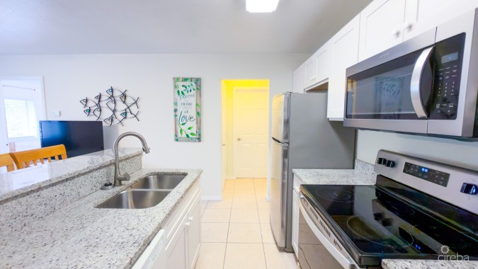 LAKESIDE K36 RENOVATED 2 BEDROOM CONDO OPPOSITE CAMANA BAY
