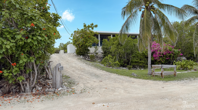 LITTLE CAYMAN OCEAN VIEW RESIDENTIAL HOME W/ BEACHFRONT LOT JUST SHY OF 1 ACRE