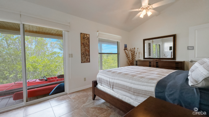 LITTLE CAYMAN OCEAN VIEW RESIDENTIAL HOME W/ BEACHFRONT LOT JUST SHY OF 1 ACRE