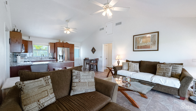 LITTLE CAYMAN OCEAN VIEW RESIDENTIAL HOME W/ BEACHFRONT LOT JUST SHY OF 1 ACRE