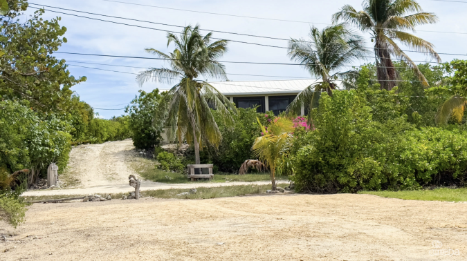 LITTLE CAYMAN OCEAN VIEW RESIDENTIAL HOME W/ BEACHFRONT LOT JUST SHY OF 1 ACRE