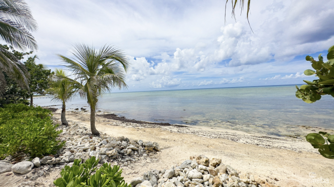 LITTLE CAYMAN OCEAN VIEW RESIDENTIAL HOME W/ BEACHFRONT LOT JUST SHY OF 1 ACRE