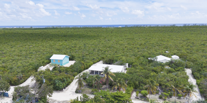 LITTLE CAYMAN OCEAN VIEW RESIDENTIAL HOME W/ BEACHFRONT LOT JUST SHY OF 1 ACRE