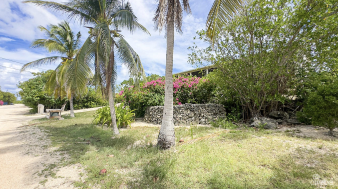 LITTLE CAYMAN OCEAN VIEW RESIDENTIAL HOME W/ BEACHFRONT LOT JUST SHY OF 1 ACRE