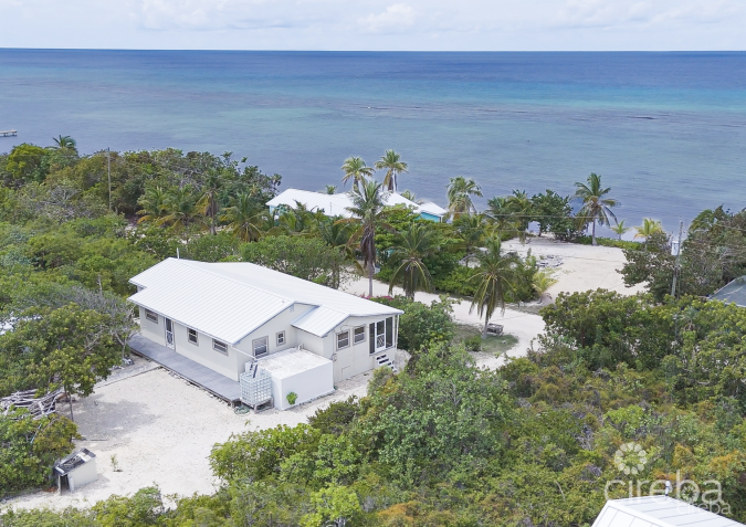 LITTLE CAYMAN OCEAN VIEW RESIDENTIAL HOME W/ BEACHFRONT LOT JUST SHY OF 1 ACRE